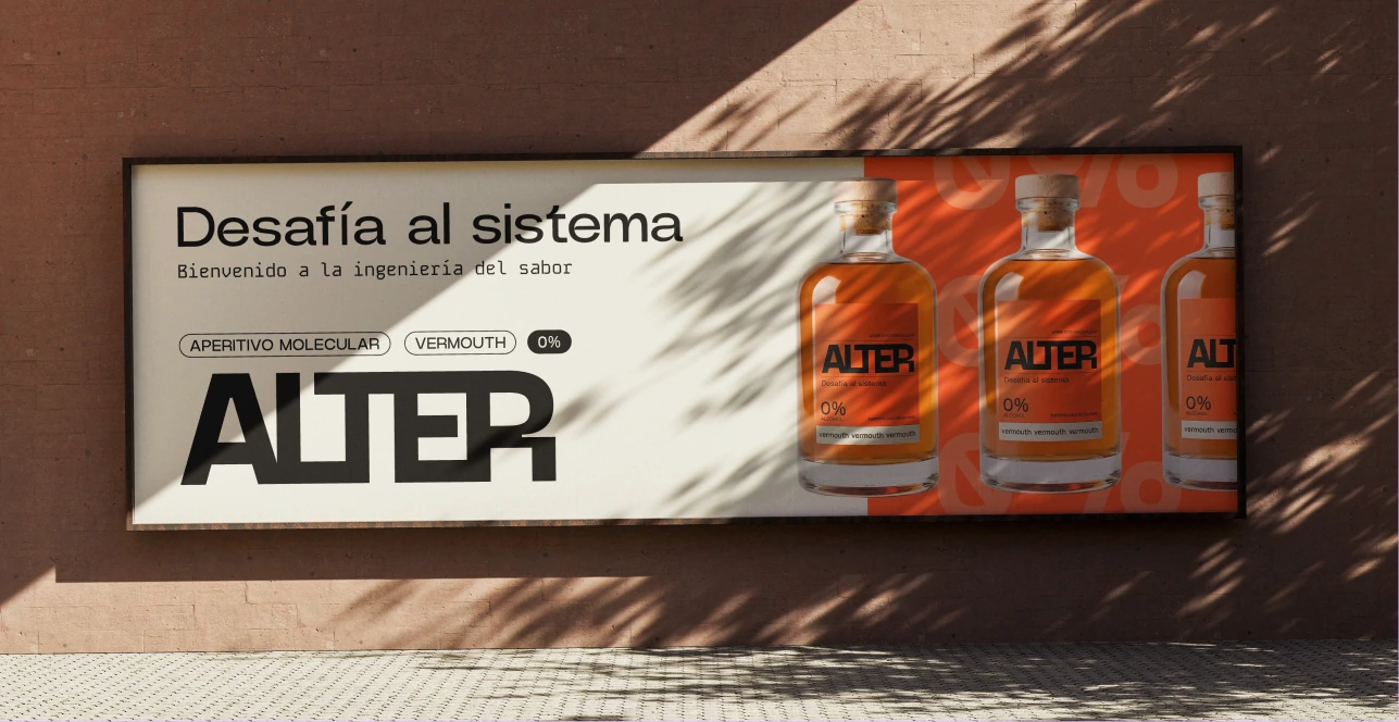 ALTER street poster with orange bottles and the message Desafía al sistema.
