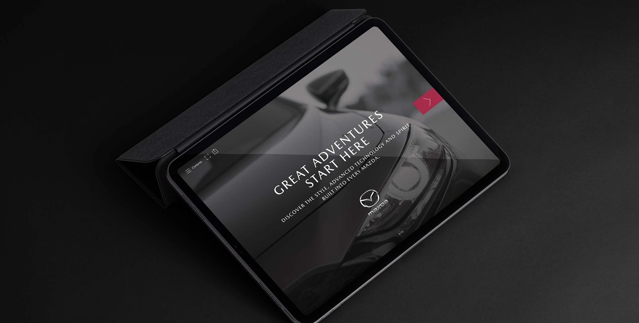 Mazda editorial content displayed on a black tablet.