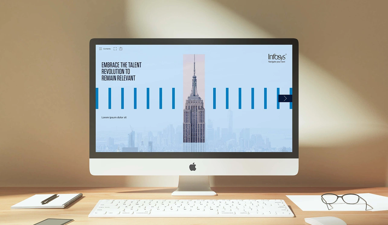 Infosys report with blue data graphics displayed on a desktop computer.