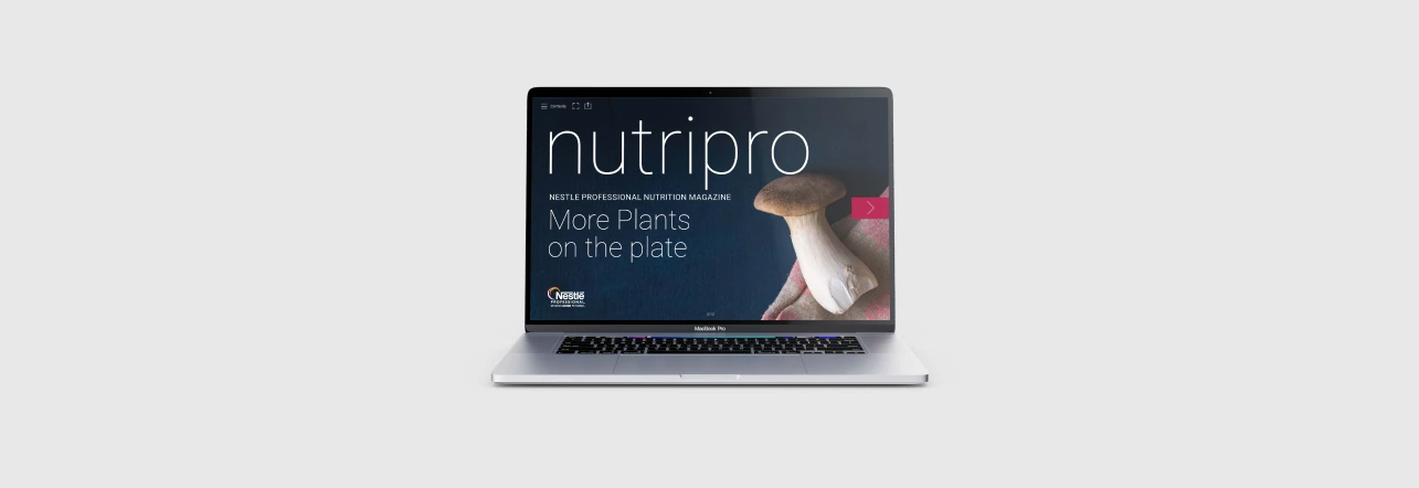 NutriPro editorial content displayed on a laptop against a pale background.