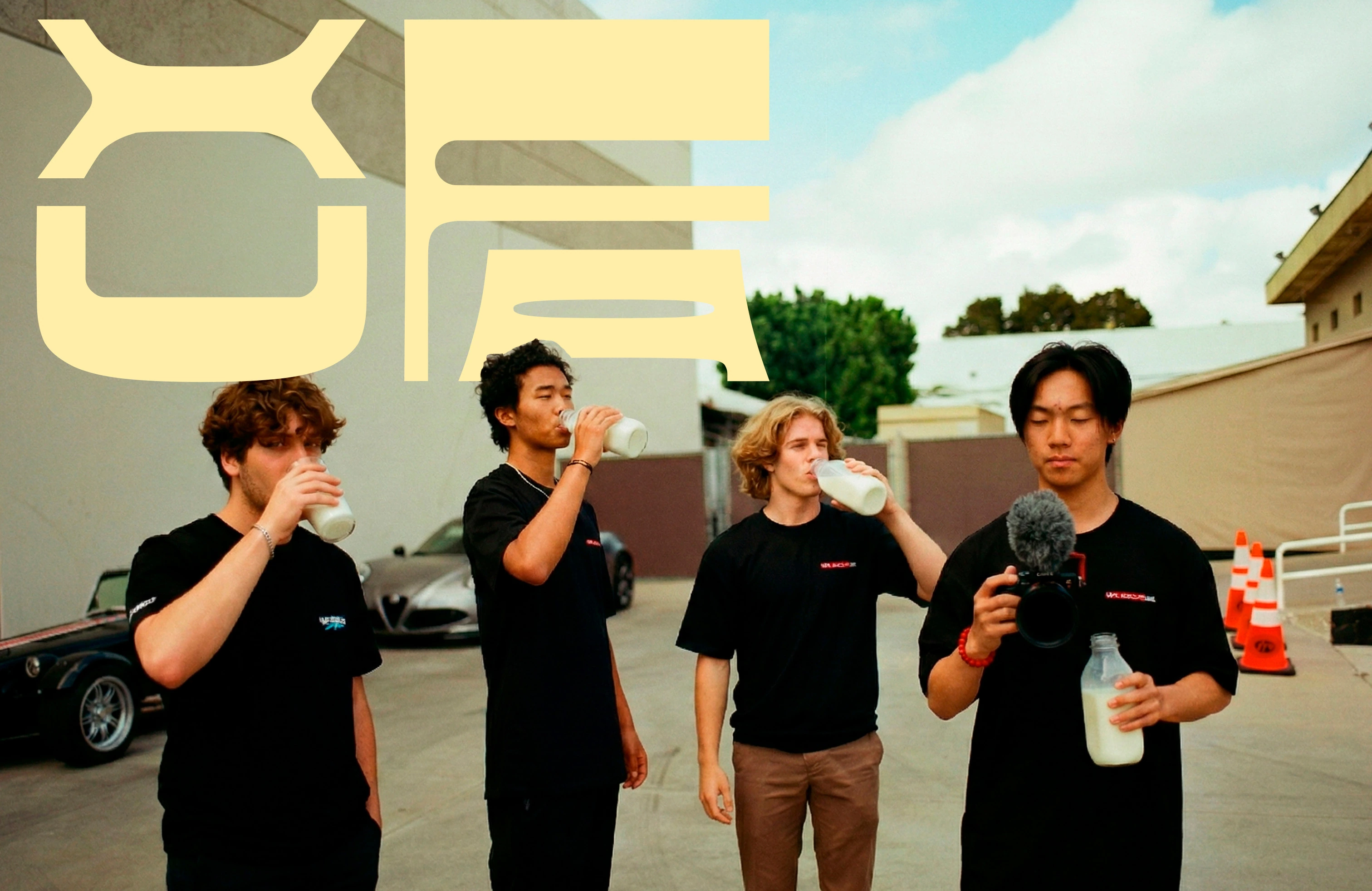 Four people drinking Xufa outdoors, overlaid with a large pale yellow brand mark.